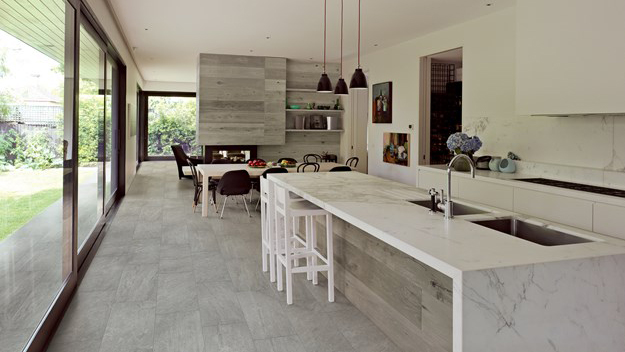 grey glazed porcelain tile flooring in a modern black and white kitchen